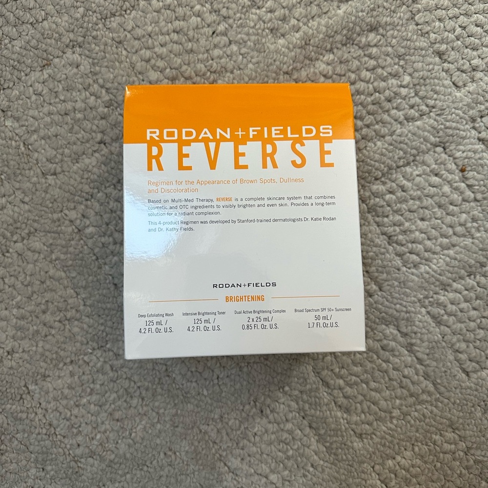 Rodan + Fields Reverse Brightening Skincare Set - Orange and White